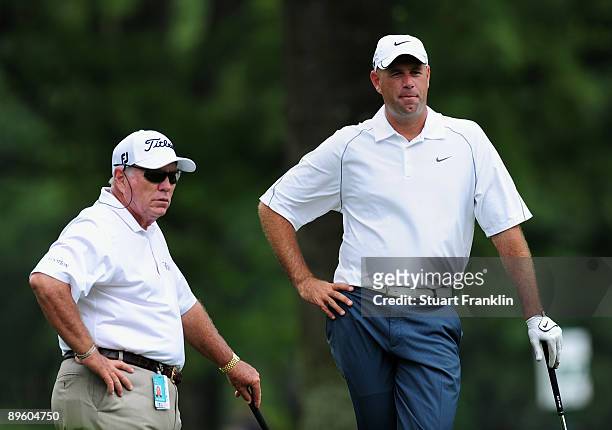 Stewart Cink of the U.S. And his coach Butch Harmon look on during a practice round of the World Golf Championship Bridgestone Invitational on August...