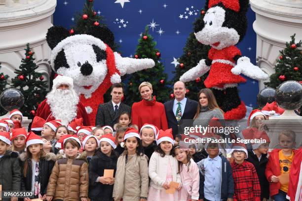 Louis Ducruet, Princess Charlene of Monaco, Prince Albert II of Monaco and Camille Gottlieb attend the Christmas Gifts Distribution on December 20,...