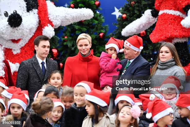 Louis Ducruet, Princess Charlene of Monaco, Prince Albert II of Monaco and Camille Gottlieb attend the Christmas Gifts Distribution on December 20,...