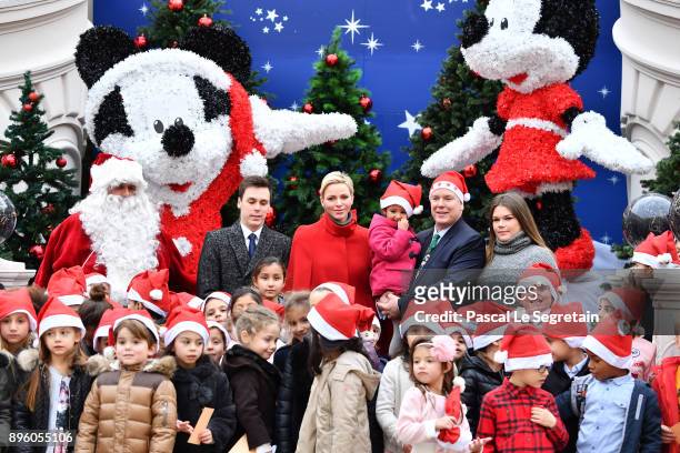 Louis Ducruet, Princess Charlene of Monaco, Prince Albert II of Monaco and Camille Gottlieb attend the Christmas Gifts Distribution on December 20,...