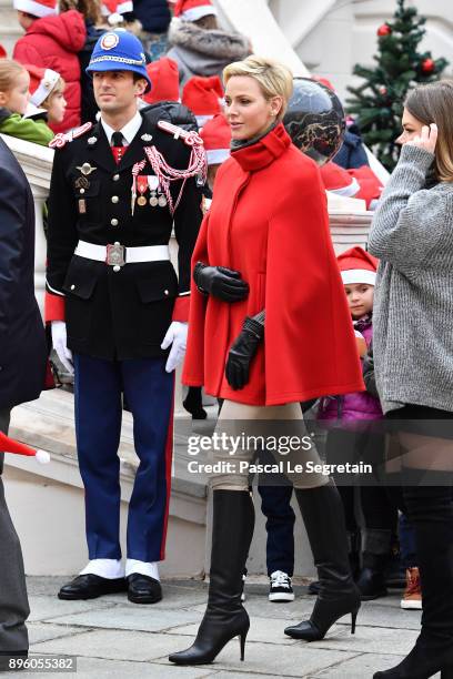 Princess Charlene of Monaco and Camille Gottlieb attend the Christmas Gifts Distribution on December 20, 2017 in Monaco, Monaco.