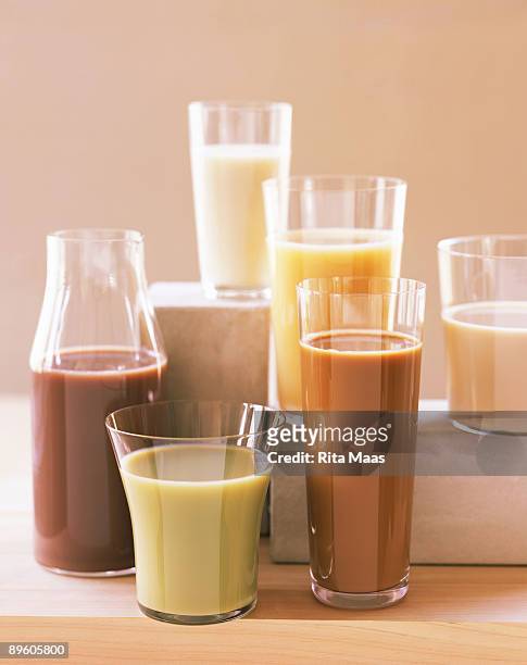 assortment of soy milks - almond milk stock pictures, royalty-free photos & images