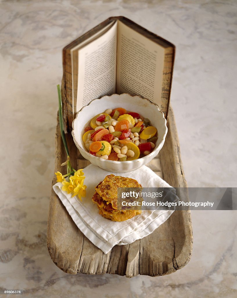 Soup with potato pancakes and book