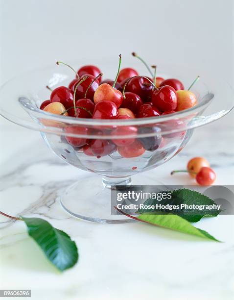 fresh cherries in glass bowl - bing cherry stock pictures, royalty-free photos & images