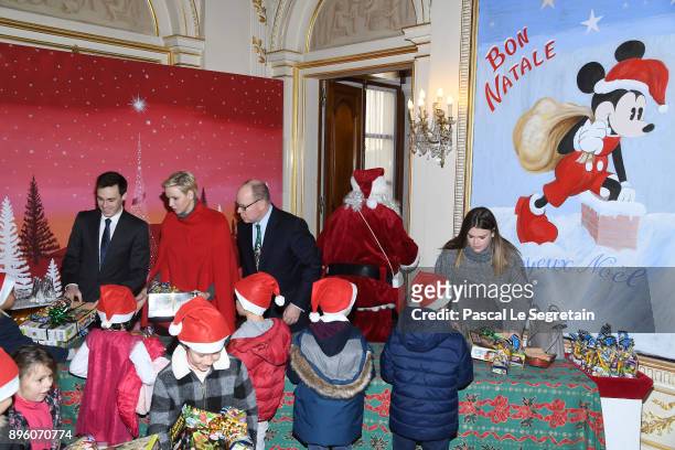 Louis Ducruet, Princess Charlene of Monaco, Prince Albert II of Monaco and Camille Gottlieb attend the Christmas Gifts Distribution on December 20,...