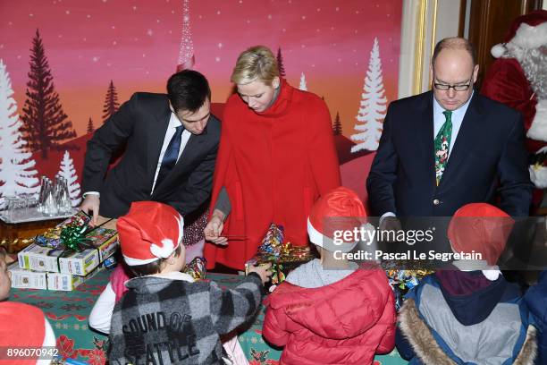 Louis Ducruet, Princess Charlene of Monaco, and Prince Albert II of Monaco attend the Christmas Gifts Distribution on December 20, 2017 in Monaco,...