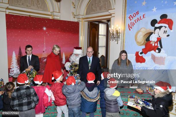 Louis Ducruet, Princess Charlene of Monaco, Prince Albert II of Monaco and Camille Gottlieb attend the Christmas Gifts Distribution on December 20,...