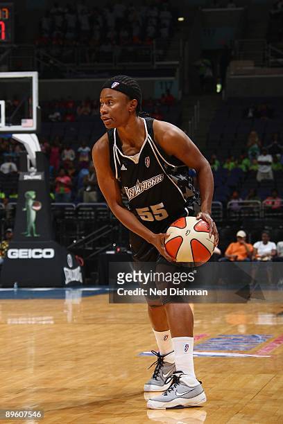 Vickie Johnson of the San Antonio Silver Stars looks to move the ball against the Washington Mystics during the game at the Verizon Center on July...