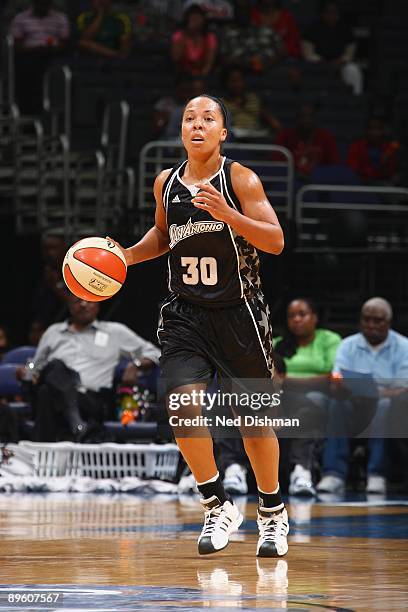 Helen Darling of the San Antonio Silver Stars moves the ball against the Washington Mystics during the game at the Verizon Center on July 15, 2009 in...