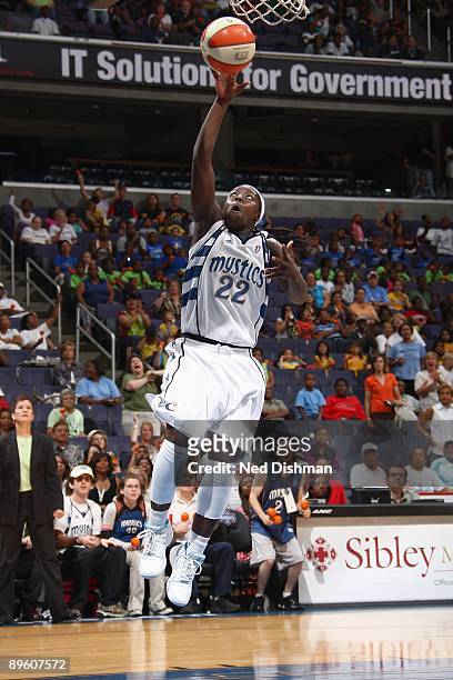 Matee Ajavon of the Washington Mystics lays up a shot against the San Antonio Silver Stars during the game at the Verizon Center on July 15, 2009 in...