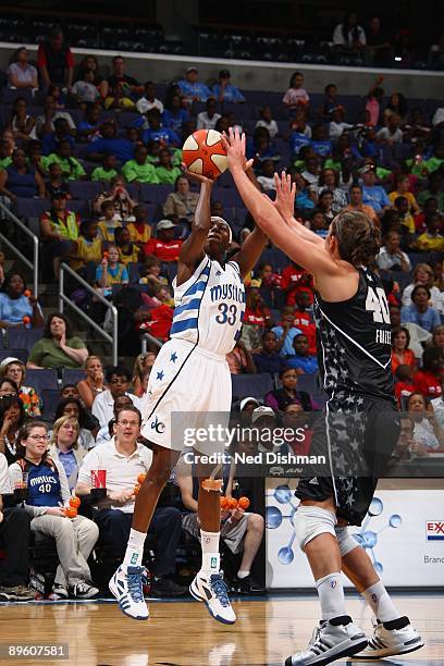 Bernice Mosby of the Washington Mystics takes a jump shot against Megan Frazee of the San Antonio Silver Stars during the game at the Verizon Center...