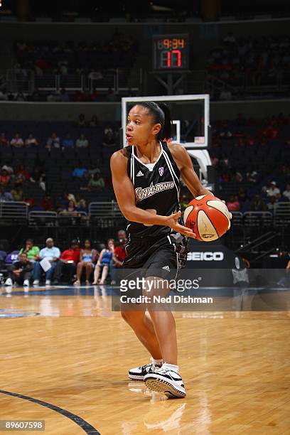 Edwige Lawson-Wade of the San Antonio Silver Stars moves the ball against the Washington Mystics during the game at the Verizon Center on July 15,...