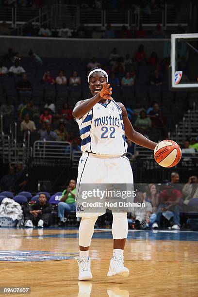 Matee Ajavon of the Washington Mystics moves the ball against the San Antonio Silver Stars during the game at the Verizon Center on July 15, 2009 in...