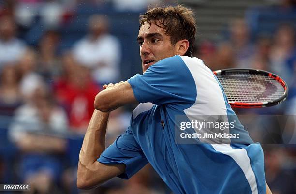 Marin Cilic of Croatia returns a shot against Somdev Devvarman of India during Day 2 of the Legg Mason Tennis Classic at the William H.G. FitzGerald...