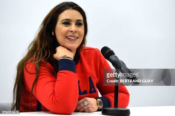 French tennis player Marion Bartoli delivers a press conference at the French Tennis Federation's national training centre in Paris on December 20,...