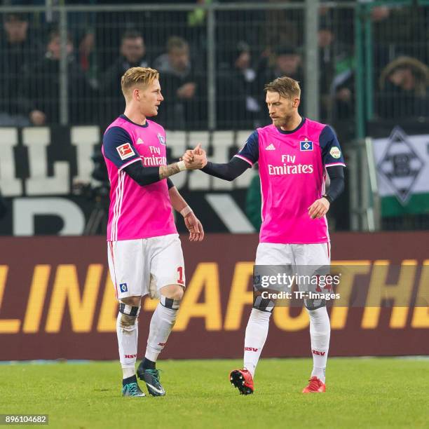 Aaron Hunt of Hamburg shakes hands with Andre Hahn of Hamburg during the Bundesliga match between Borussia Moenchengladbach and Hamburger SV at...