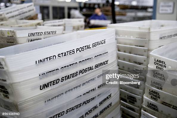 Stacks of United States Postal Service flat tubs sit at the USPS ...