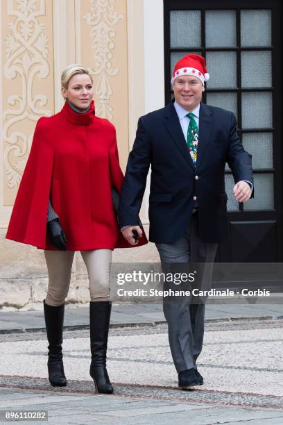 Princess Charlene of Monaco and Prince Albert II of Monaco attend the Christmas Gifts Distribution on December 20, 2017 in Monaco, Monaco.