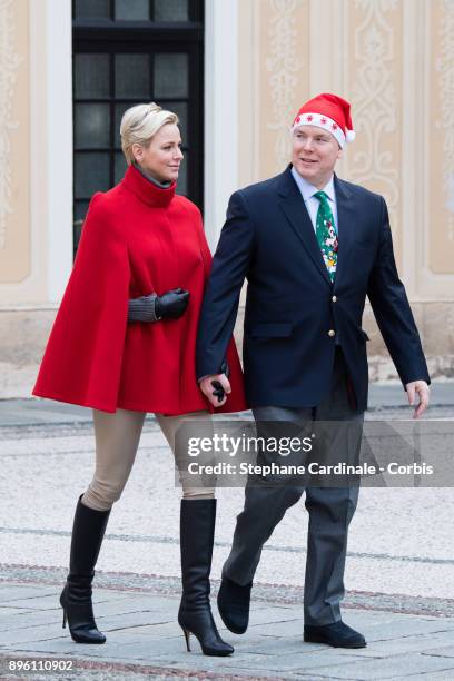 Princess Charlene of Monaco and Prince Albert II of Monaco attend the Christmas Gifts Distribution on December 20, 2017 in Monaco, Monaco.