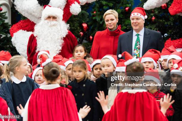 Princess Charlene of Monaco and Prince Albert II of Monaco attend the Christmas Gifts Distribution on December 20, 2017 in Monaco, Monaco.