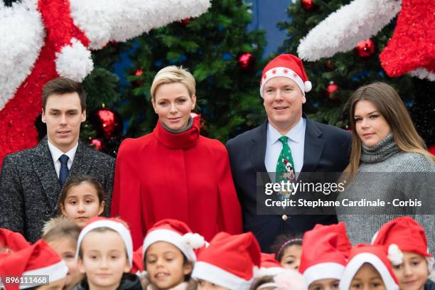 Louis Ducruet, Princess Charlene of Monaco, Prince Albert II of Monaco and Camille Gottlieb attend the Christmas Gifts Distribution on December 20,...