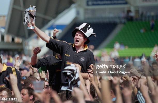 Newcastle Falcons player Doddie Weir celebrates with the trophy after the Falcons had beaten Harlequins to claim the 1997/98 Allied Dunbar...