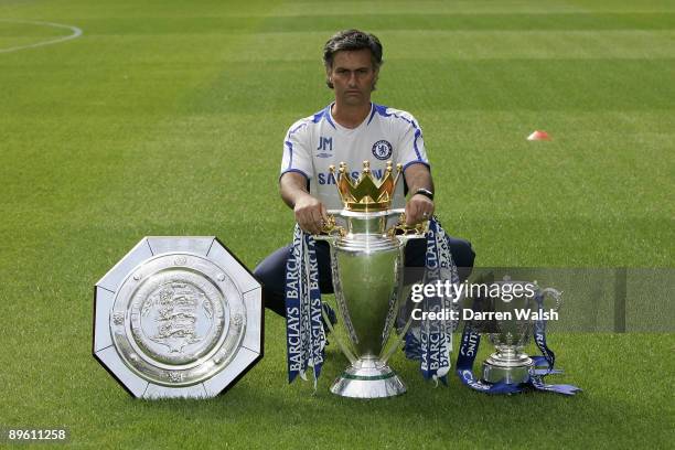 Chelsea manager Jose Mourinho with the FA Community Shield, the FA Barclays Premiership and the Carling Cup trophies at Chelsea FC's Pre-Season Open...