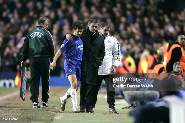 Chelsea manager Jose Mourinho shows sympathy to midfielder Joe Cole after substituting him early during the UEFA Champions League Last 16 First Leg...