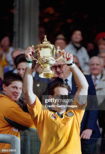 Australia winger David Campese lifts the World Cup after the 1991 Rugby Union World Cup Final between England and Australia at Twickenham on November...