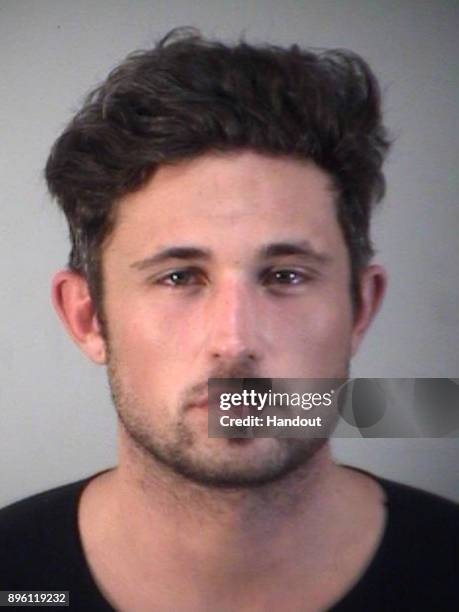 In this handout photo provided by the Lake County Sheriff's office, Country star singer Michael Ray Roach poses for his mugshot after his arrest for...