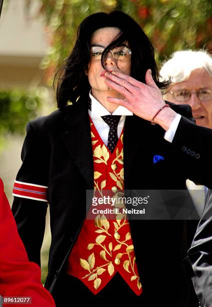 Pop superstar Michael Jackson departs the Santa Barbara Superior Court in Santa Maria, California at the end of the 52nd day of Jackson's child...