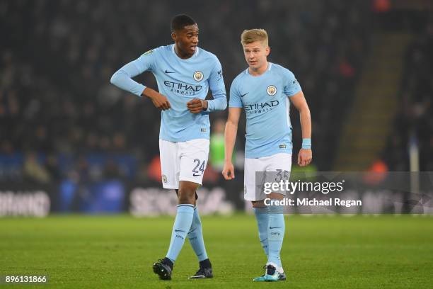 Tosin Adarabioyo of Manchester City speaks to team mate Oleksandr Zinchenko during the Carabao Cup Quarter-Final match between Leicester City and...