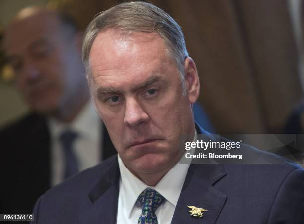 Ryan Zinke, U.S. Secretary of interior, listens during a cabinet meeting with U.S. President Donald Trump, not pictured, at the White House in...