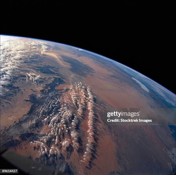 two great sand seas occupy northern algeria, grand erg oriental (eastern sand sea) and grand erg occidental (western sand sea). both sand seas occupy depressions that are separated by a north-south rise called mizab. - africa from space stock pictures, royalty-free photos & images