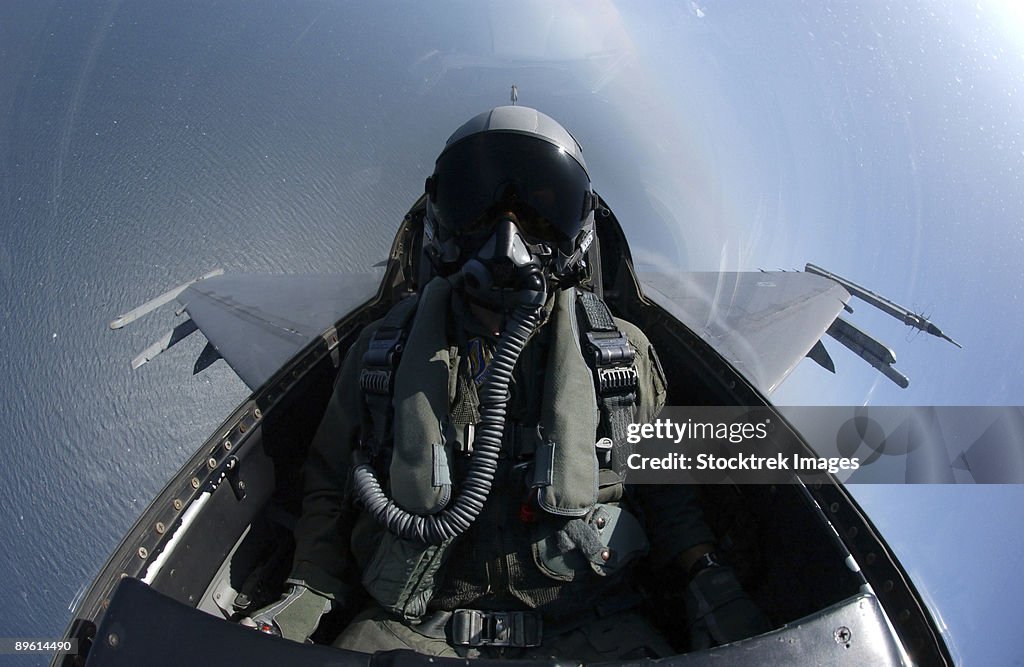 August 18, 2006 - An F-16 Fighting Falcon searches for boats off the coast of South Korea during an AIM-9 missile live-fire exercise.