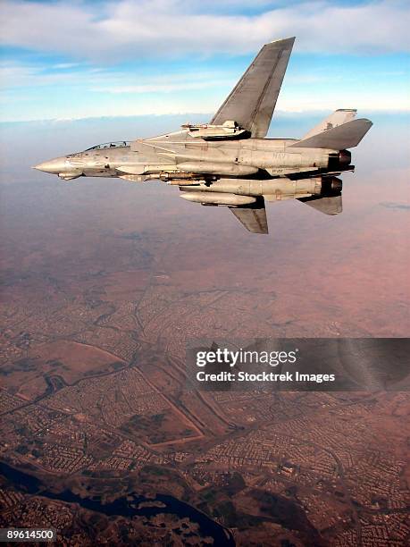 northern iraq, december 1, 2005 - an f-14d tomcat conducts a mission over northern iraq.   - f 14 tomcat stock pictures, royalty-free photos & images