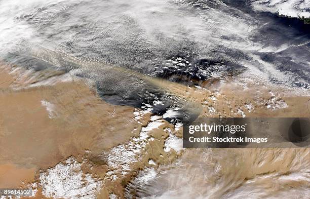 january 12, 2009 - dust blows off the coast of libya heading west-northwest over the mediterranean sea. - dust storm stock pictures, royalty-free photos & images