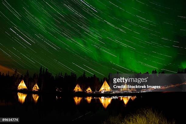 september 7, 2008 - aurora and star trails, aurora lake, yellowknife, northwest territories, canada. - yellowknife canada stock pictures, royalty-free photos & images