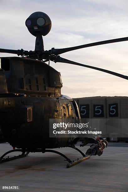 an oh-58d kiowa helicopter during sunset. - camp speicher stock pictures, royalty-free photos & images