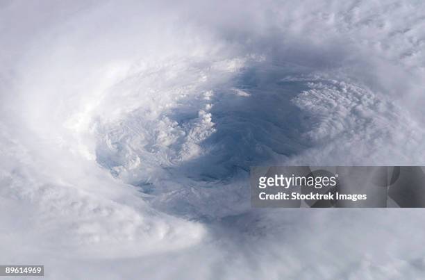 september 13, 2003 - eye of hurricane isabel as seen from the international space station. - hurricane eye stock pictures, royalty-free photos & images