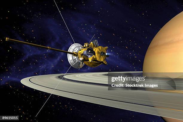 this is an artists concept of cassini during the saturn orbit insertion (soi) maneuver, just after the main engine has begun firing.  - cassini spacecraft stock illustrations