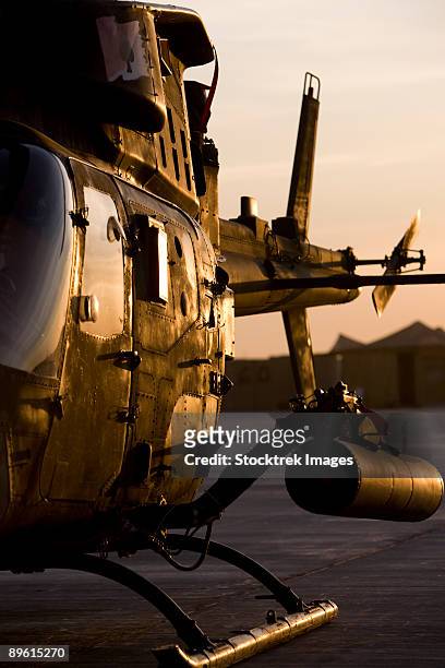 an oh-58d kiowa during sunset. - camp speicher stock pictures, royalty-free photos & images