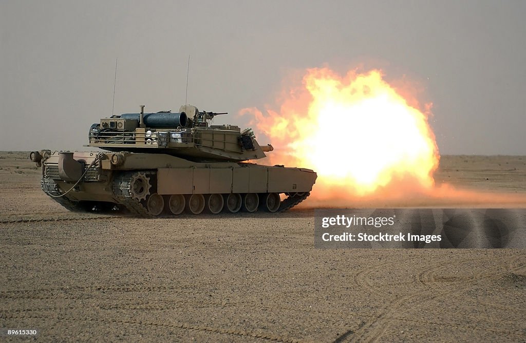 US Marine Corps personnel fire their M1A1 Main Battle Tank gun at Forward Operating Base Duke, Iraq, in support of Operation Iraqi Freedom.