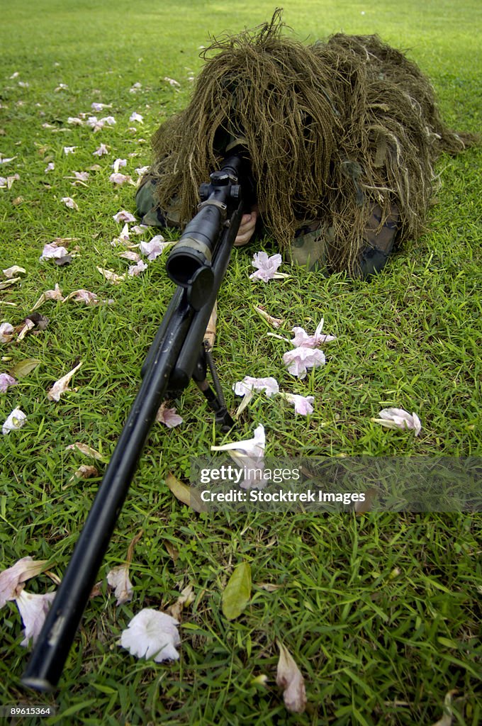 Andersen Air Force Base, Guam - Soldier practices sniper tactics during a run-through exercise. 