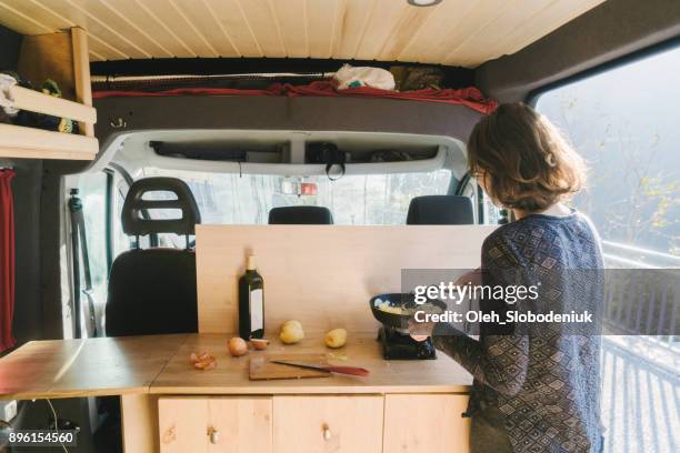 Woman cooking fried potato in the van