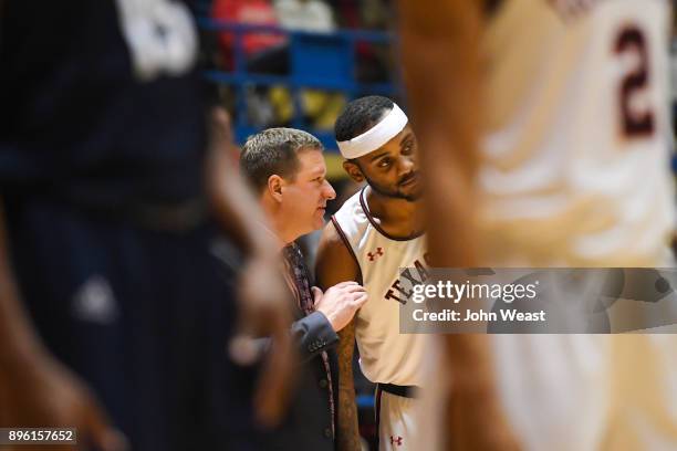 Head coach Chris Beard of the Texas Tech Red Raiders talks with Tommy Hamilton IV Raiders during the game against the Rice Owls on December 16, 2017...