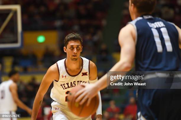 Davide Moretti of the Texas Tech Red Raiders defends against Miles Lester of the Rice Owls during the game on December 16, 2017 at Lubbock Municipal...