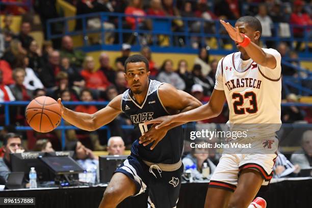 Connor Cashaw of the Rice Owls drives to the basket against Jarrett Culver of the Texas Tech Red Raiders during the game on December 16, 2017 at...