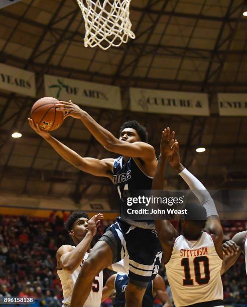 Najja Hunter of the Rice Owls goes to the basket against Niem Stevenson of the Texas Tech Red Raiders during the game on December 16, 2017 at Lubbock...
