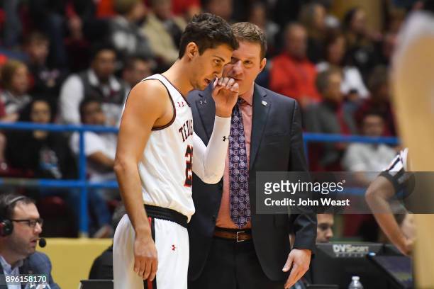 Head coach Chris Beard of the Texas Tech Red Raiders talks with Davide Moretti during the game against the Rice Owls on December 16, 2017 at Lubbock...